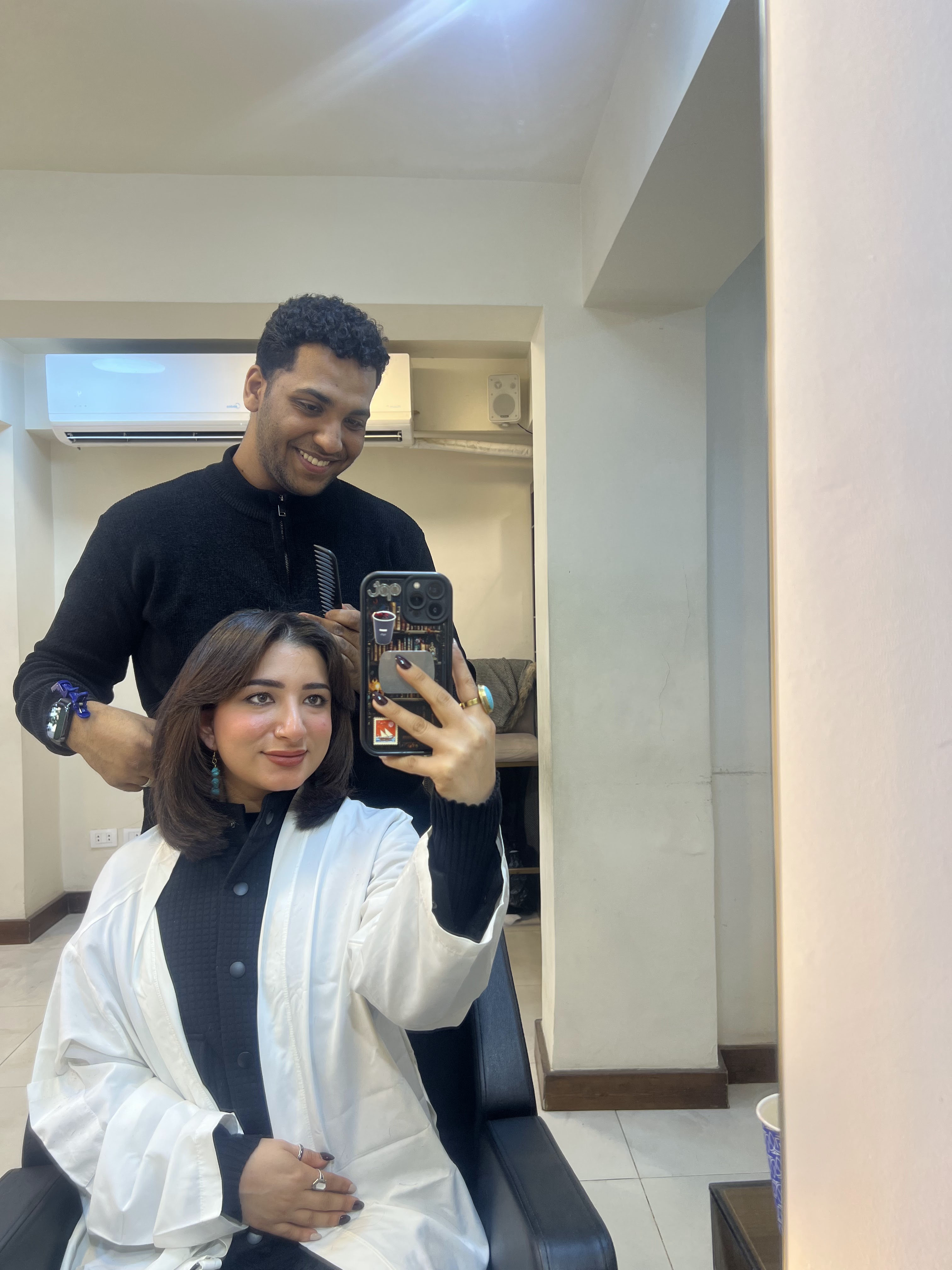 Client and stylist at the styling mirror